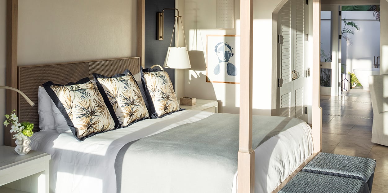 Jumby Bay Pond Bay Suite Bedroom with evening light