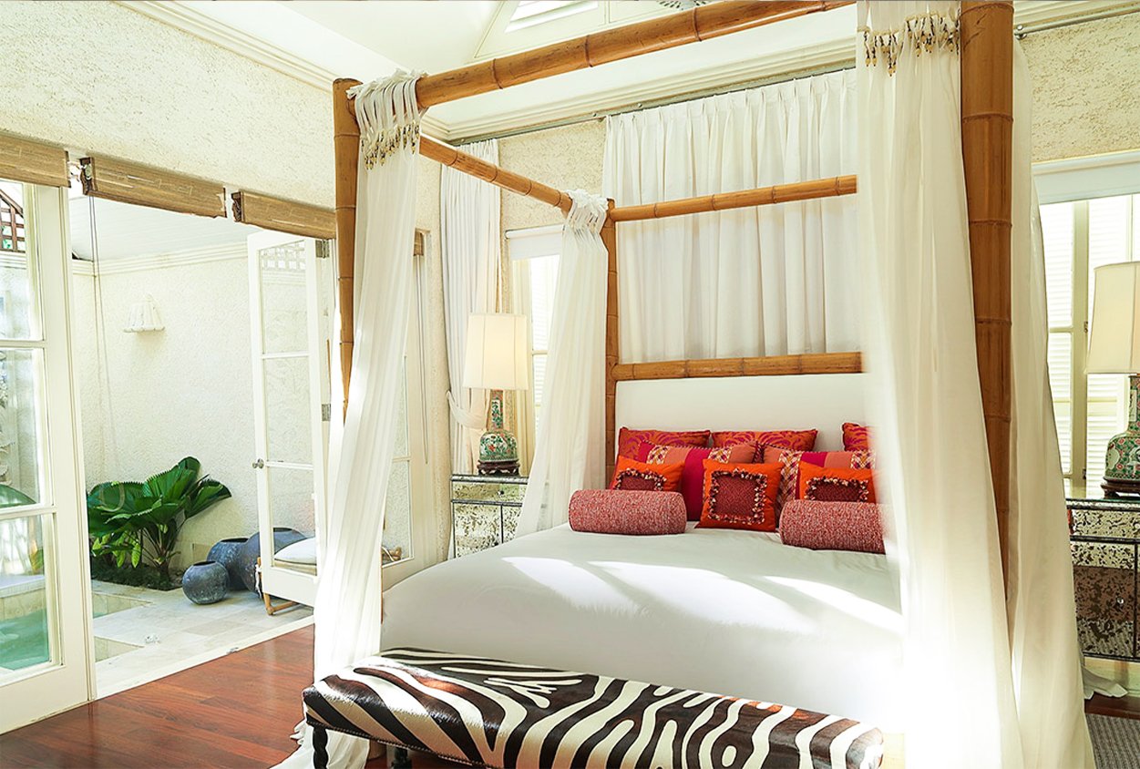 Canopy bed next to outside hot tub at Roaring Pavilion, Jamaica
