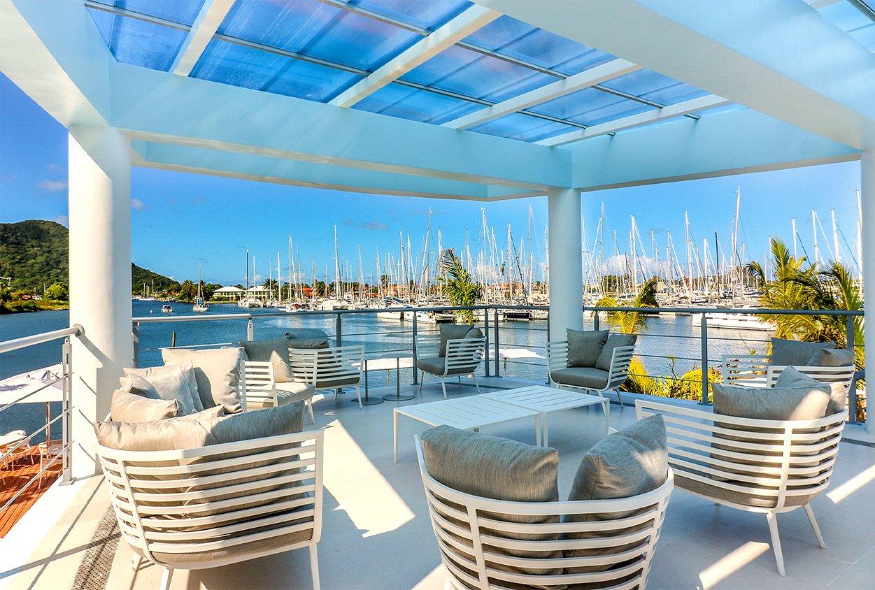 Outside seating overlooking the water at The Harbor Club