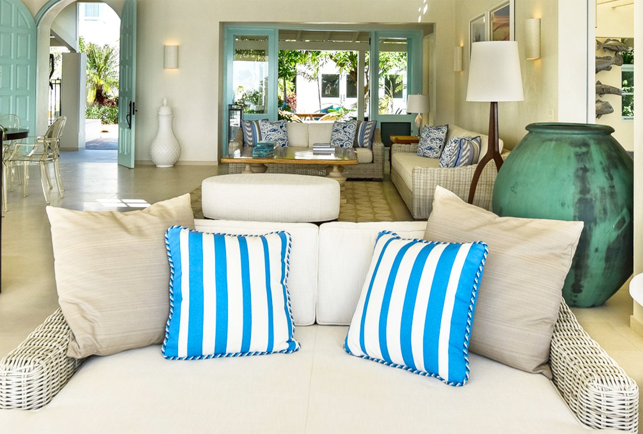 Couches in an indoor seating area in Private Estate Home in Jumby Bay