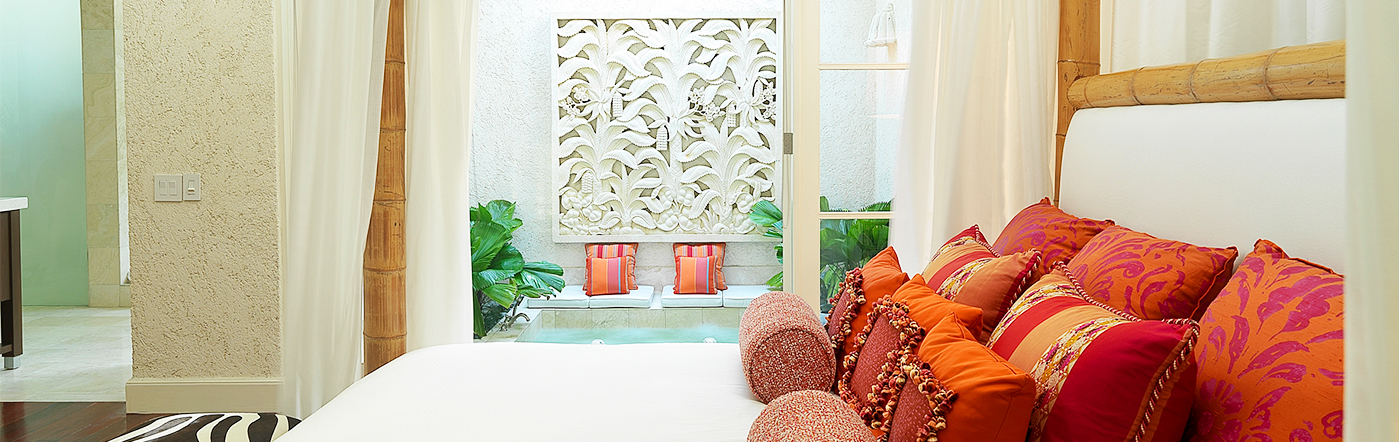 Canopy bed with red pillows