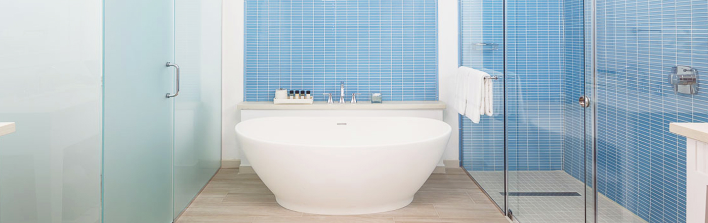 Bathroom with tub and glass shower